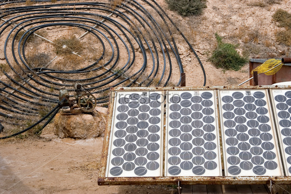 homemade solar energy sources and water heaters at an alternative energy farm using recycled materials