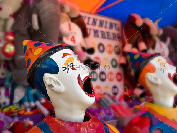 sideshow clowns with big mouths at the funfair