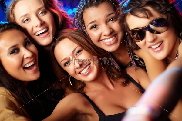 Close-up shot of group of laughing girls having party