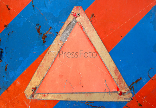 Weathered warning sign against an industrial metal surface. Scratched paint and rust background. Place your own text.