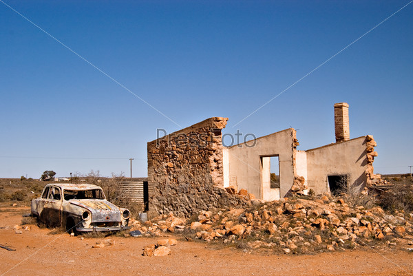 an old car and ruins in the australian outback