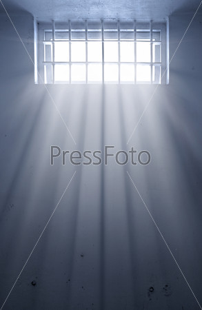a cold prison cell with sunshine through window