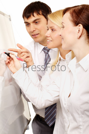 Team of three confident business people discussing future project