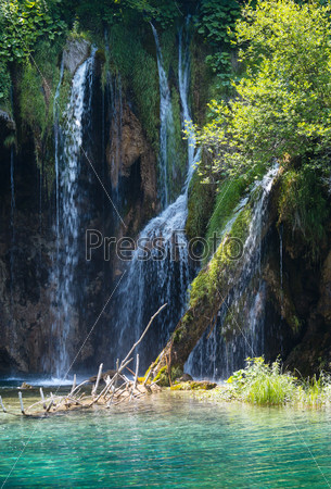 Waterfall and green lake in Plitvice Lakes National Park (Croati