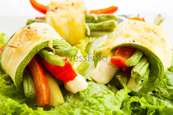 Fresh vegetable rolls with young zucchini, tomatoes, paprika, beans, celery and cheese