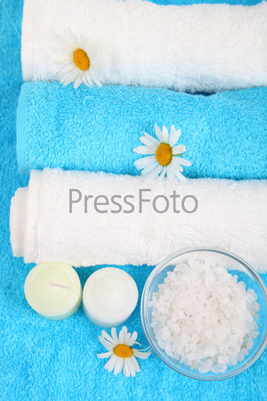 Spa still life with towels, flowers and salt