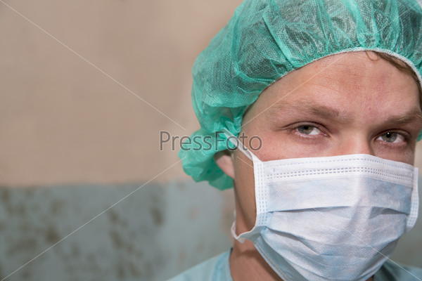 Surgeon zoomed serious face before coming difficult surgery