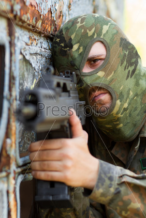 Portrait of terrorist with a gun