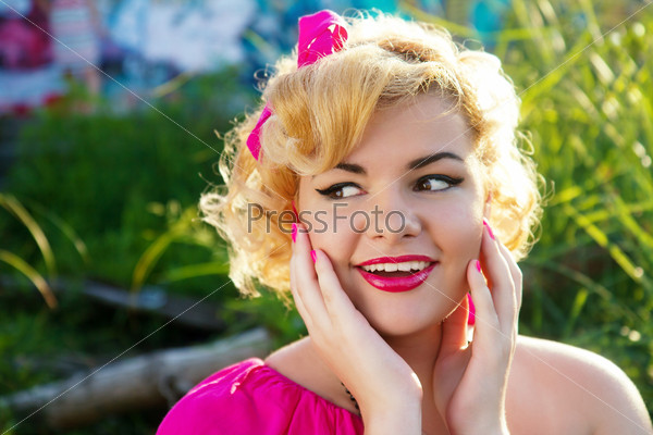 Portrait of beautiful young sexy pin-up surprised woman with vintage make-up and hairstyle