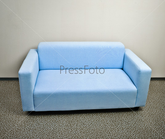 Blue sofa furniture on gray floor