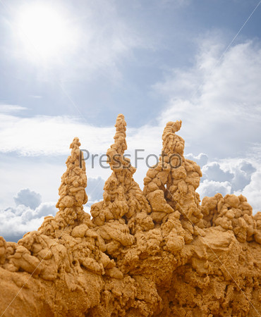 Bizarre sand castles on sky background
