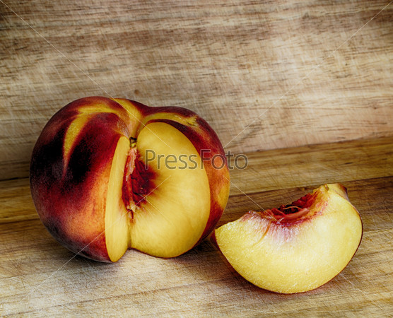 sliced peach on a wooden table