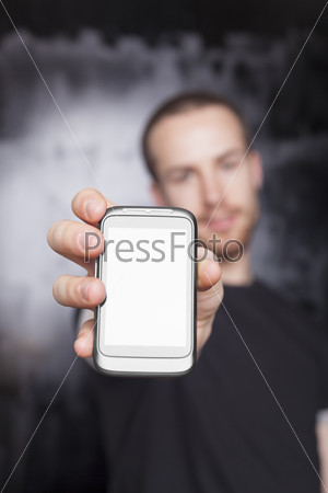Men showing screen of cell phone, focus on smartphone
