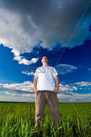 man standing on field and looking far away