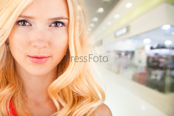 beautiful woman on the background of the shop interior
