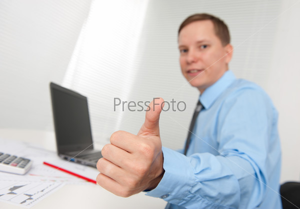 Business man with thumbs up gesture