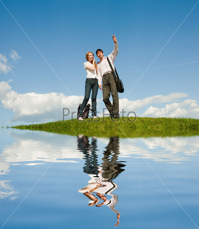 Happy young couple looking . Reflected in Water