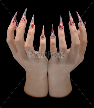 Closeup of hand of young woman long nail-art manicure on nails isolated on black