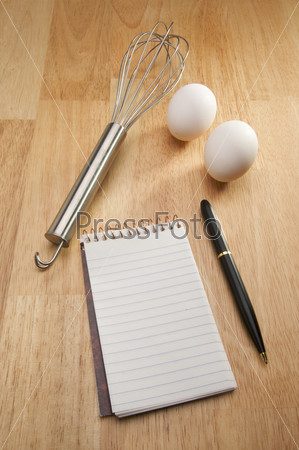 Whisk, Eggs, Pen and Pad