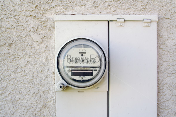 Electric Meter on Stucco Wall