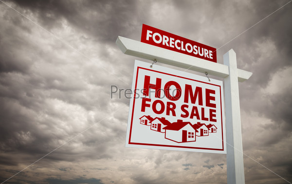White and Red Foreclosure Home For Sale Real Estate Sign Over Ominous Cloudy Sky.