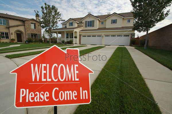 Welcome, Please Come In Real Estate Sign with new home in the background.