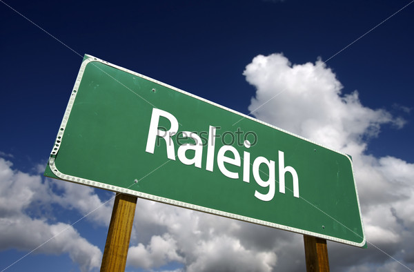 Raleigh Road Sign with dramatic blue sky and clouds - U.S. State Capitals Series.