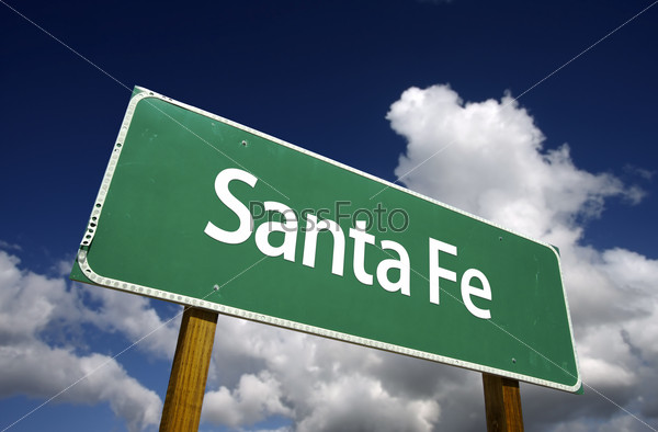 Santa Fe Road Sign with dramatic blue sky and clouds - U.S. State Capitals Series.