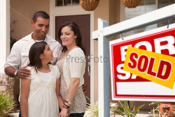 Hispanic Family in Front of New Home and Sold Sign