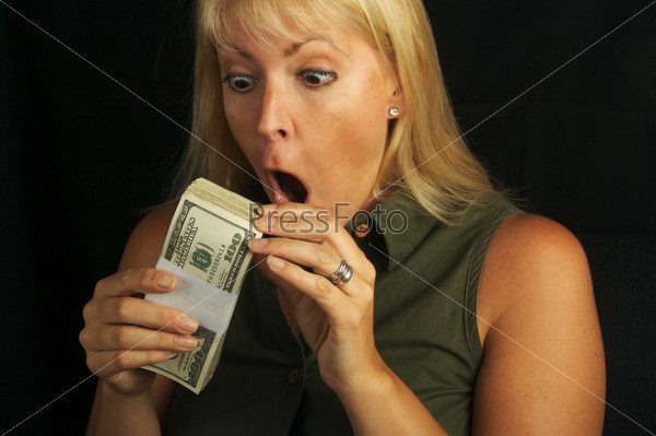 Attractive Woman Excited About her Stack of Money She Holds