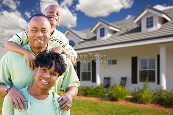 Attractive African American Family in Front of Beautiful House, stock photo