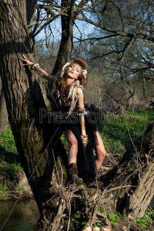 Rain forest scenery. Nature. Tribe style. Fashion woman in wood