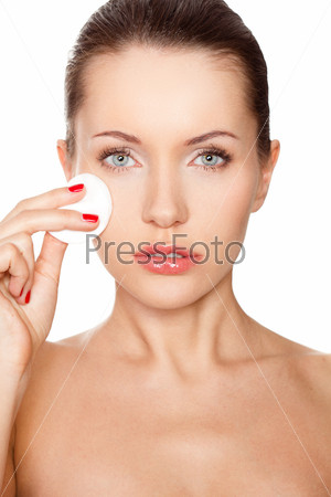 Woman cleaning her face