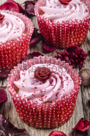 strawberry cupcake with pink shimmer sugar and hand made rose