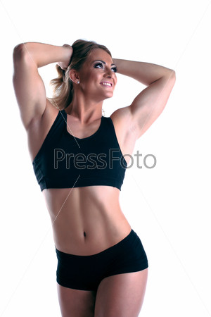 Athletic woman body builder posing isolated