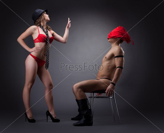 woman undress red cloth before nude man