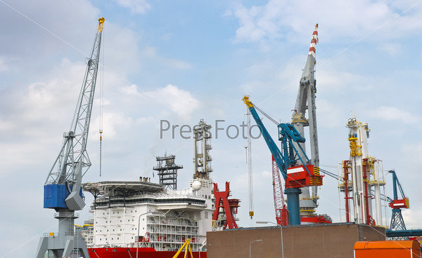 Industrial landscape. Ship and crane in shipyard