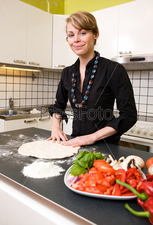 Young Woman Making Pizza Dough
