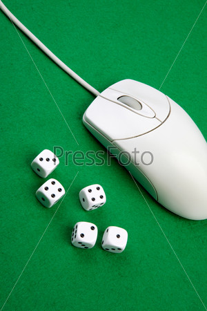 Dice and a computer mouse on a green background. - Online Gaming concept