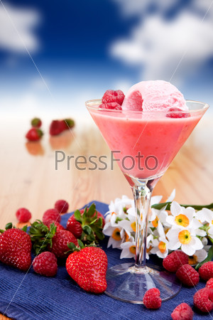 A fancy glass of milk shake smoothie made from fresh berries