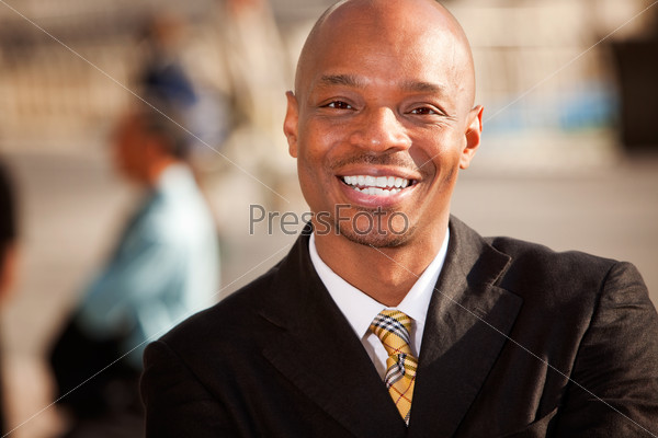 An portrait of an African American Business Man in an outdoor setting