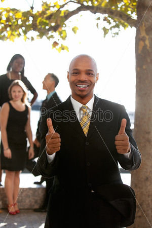An african american business man with thumbs up