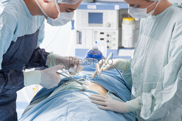 Medical experts during a surgical operation in operation theatre