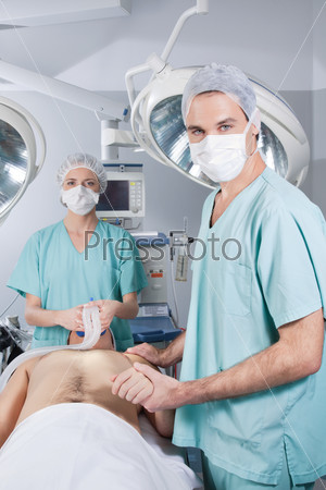 Surgeon nursing the patient before the operation in hospital