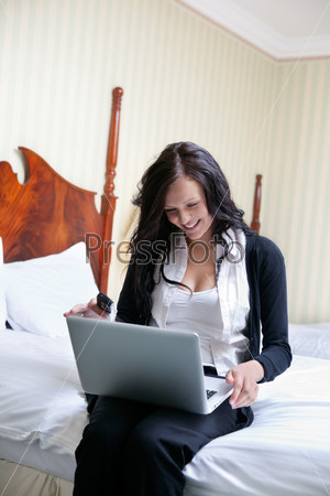Smiling Businesswoman Using Laptop
