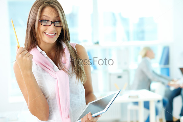 Portrait of cute secretary with touchpad looking at camera
