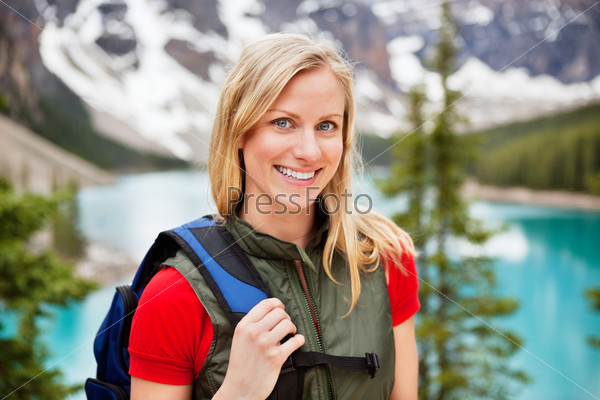 Portrait of happy beautiful female hiker smiling