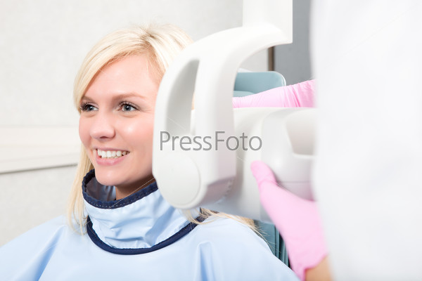 A woman having her teeth x-rayed