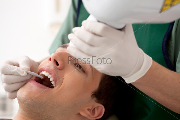 Dentist Preparing X-Ray