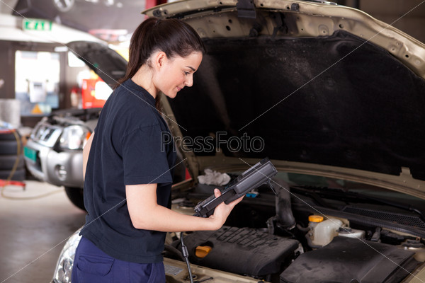 Woman Mechanic with Diagnostics Tool